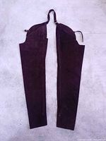 Full view of both chap legs laid flat showing overall design and color