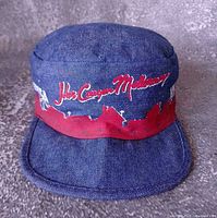 Front and top view of denim painter’s hat with tour graphics visible