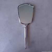 Front view showing mirror glass and overall shape