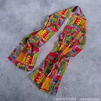 Full view of entire scarf showing length and multicolor patchwork design