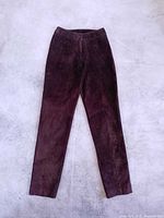 Full front view of brown suede leather pants