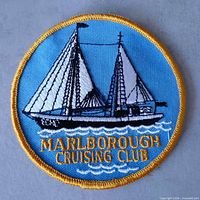 Full view of patch showing boat, text, border