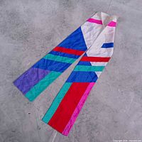 Full length view of multicolor silk scarf on flat surface