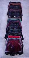Stack of 30 skirts showing variety of colours and textures