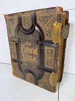 Front cover showing gilt title, embossed leather design