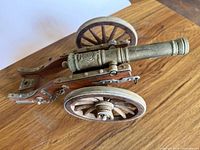 Top view of brass barrel and wooden carriage cannon