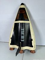 Front view of shuttle standing on four copper thrusters