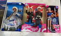 Three boxed Barbie sets: The Sound of Music Maria, Marine Corps Barbie & Ken, Walt Disney World 25th Anniversary Barbie