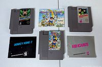 Overview of three NES cartridges and three instruction booklets