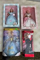 Overview of all four boxed Barbie dolls