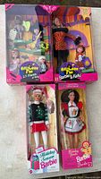 Group shot of all four boxed Barbie doll sets