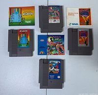 Overview showing three NES cartridges and three manuals