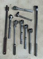 All eight drive tools laid out for size and type reference