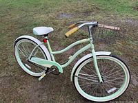 Full left-side view showing entire bicycle, color, fenders, saddle and overall condition