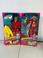 Both Baywatch Barbie and Ken dolls in sealed boxes
