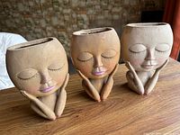 All three matching face planters side by side on table