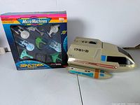 Front of Micro Machines Star Trek box and shuttlecraft side view