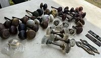 Group shot of all door knob sets with additional plates and screws