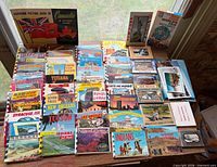 Full lot overview of postcard booklets, picture folders, slides