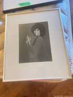 Framed black-and-white photo of Rita Moreno, full view