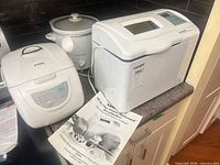 Group view of all three appliances and manuals