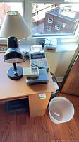 Overall lot on desk showing lamps, calculator, clock radios, shredder head and waste bin