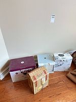 Four boxed sets of glassware on floor