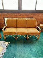 Front view of bamboo twig loveseat with cushions