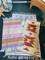 Three rugs/mats layered; area rug beneath, two mats on top