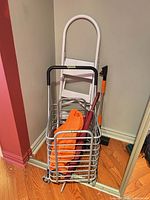 Overall lot: cart, ladder, umbrella, bag, brush