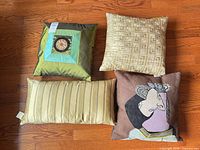 Group shot of four cushions showing designs