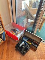 Overall lot showing drill case, toolbox, storage tote