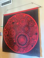 Full view of wall hanging displaying pattern and hanging hardware