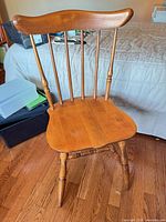 Front view of solid wood spindle-back chair