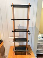 Front view of 5-shelf black and oak engineered wood bookshelf