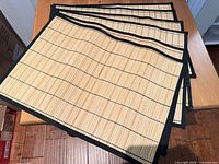 Stack of six bamboo placemats showing overall design