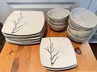 Stack of 8 dinner plates, 5 salad plates, 7 bowls displaying motif