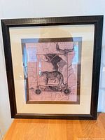 Front view of framed artwork showing image, mat and frame