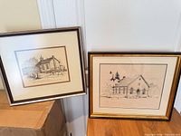 Both framed prints side by side