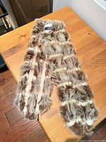 Full view of faux fur scarf laid out showing colour pattern and pile