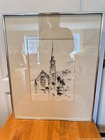 Front view of framed ink drawing showing full artwork and frame