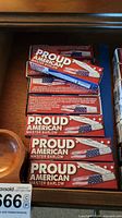 Stack of Proud American Master Barlow boxed knives