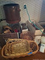 Overall lot showing baskets, wooden fruit box, candle holder, wooden bucket