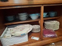 Cabinet view showing stacked plates, platter, carrier, separators