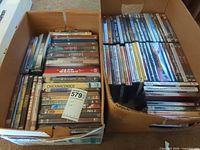 Both boxes filled with DVDs, overview of quantity