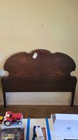 Front view of dark wood headboard