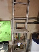 Ladder full view leaning against wall