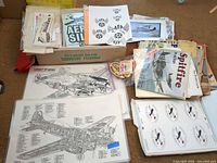 Overview of paper plans, magazines, decals in box