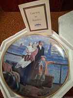 Franklin Mint Gateway to America plate in styrofoam with booklet visible
