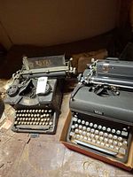 Both Royal typewriters side by side on floor
